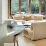 Modern living room with stylish furniture and large window